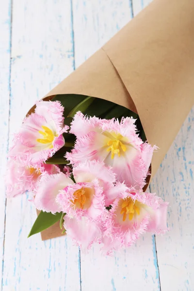 Beautiful tulips on wooden table background — Stock Photo, Image