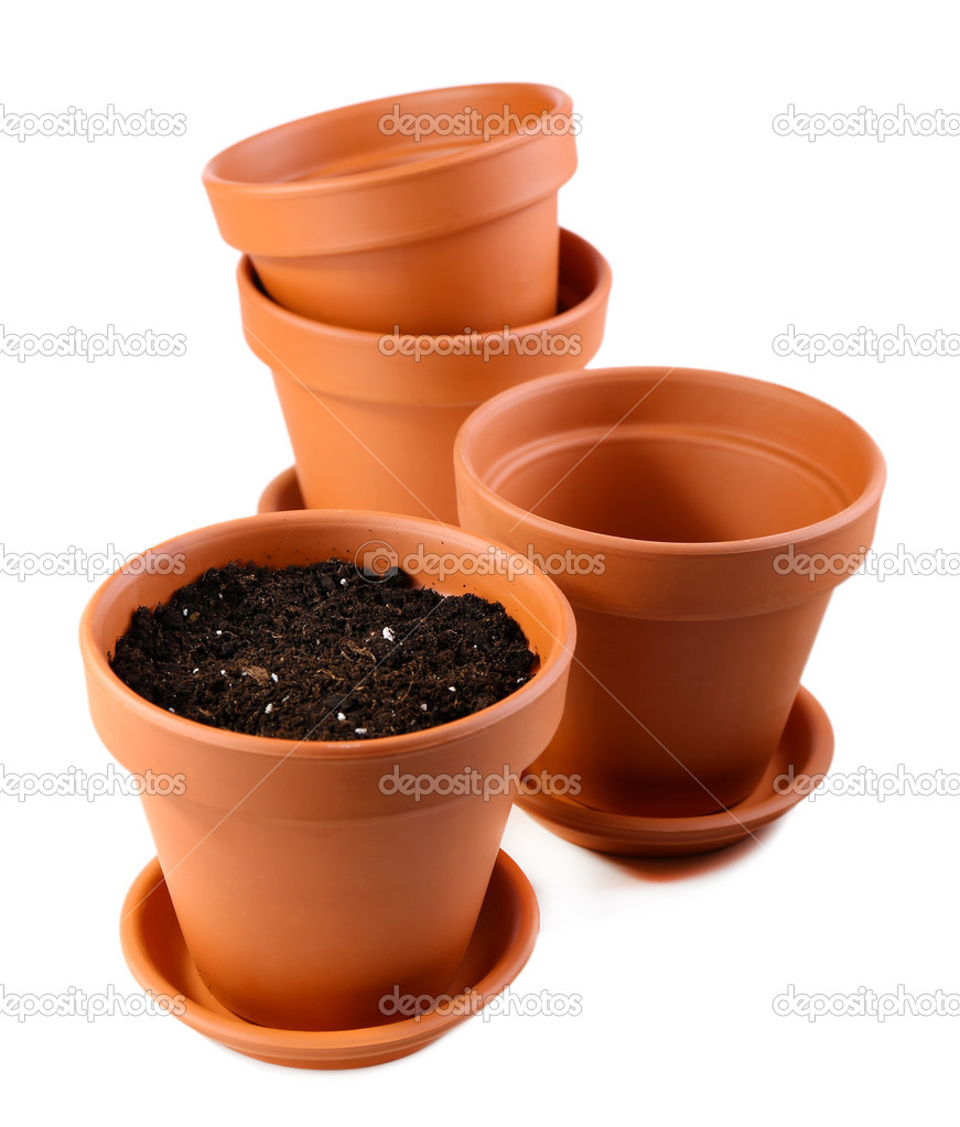 Clay flower pots and soil, isolated on white 