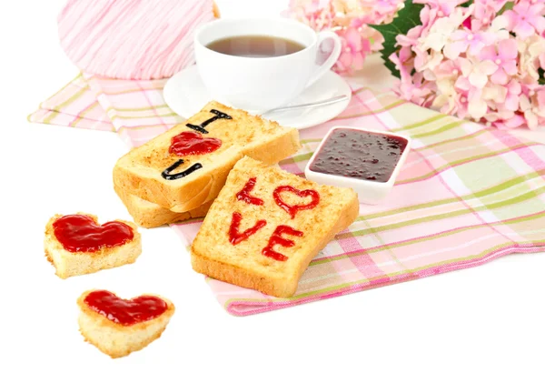 Delicious toast with jam and cup of tea on table close-up — Stock Photo, Image