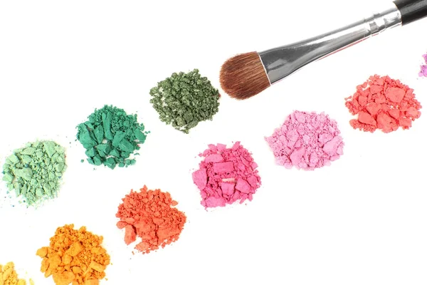 Colorful crushed eyeshadow and professional make-up brush isolated on white — Stock Photo, Image