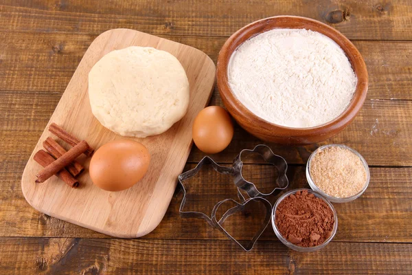 Ingredients for making cookies on wooden background — Stock Photo, Image