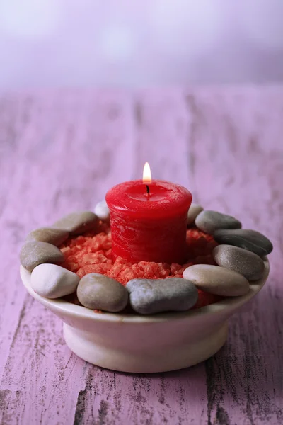 Composition with spa stones, candle  on color wooden table background — Stock Photo, Image