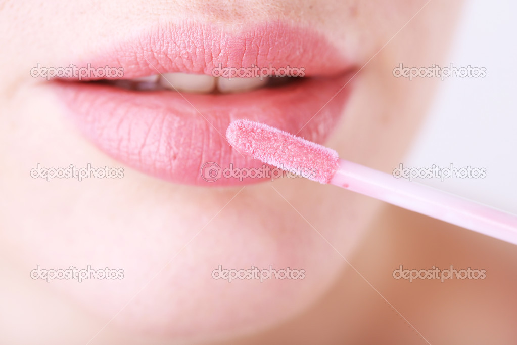 Beautiful make up of glamour pink gloss lips, close up