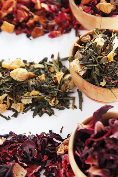 Different kinds of dry tea in bowls close up — Stock Photo, Image