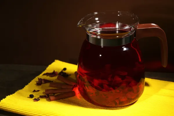 Jar of herbal tea on table, on dark background — Stock Photo, Image