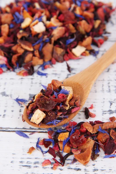 Aromatic dry tea on wooden background — Stock Photo, Image