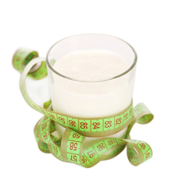 Glass of milk with measuring tape isolated on white — Stock Photo, Image