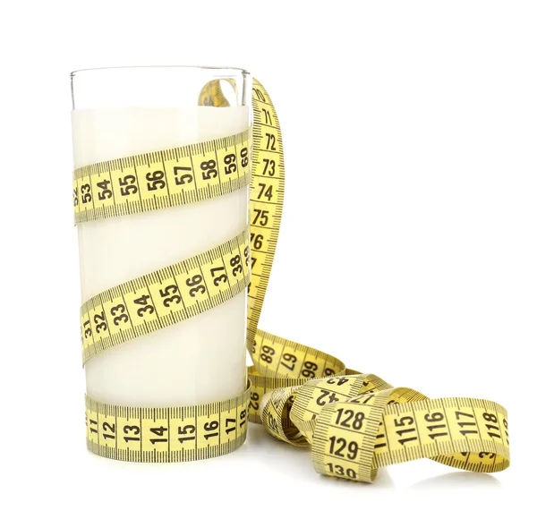 Glass of milk with measuring tape isolated on white — Stock Photo, Image