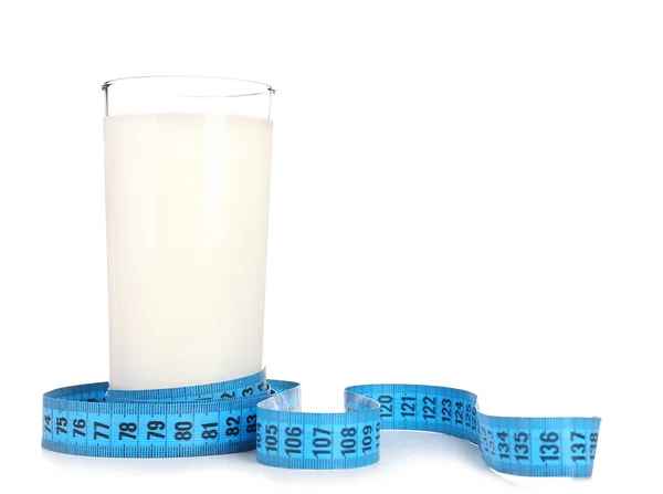 Glass of milk with measuring tape isolated on white — Stock Photo, Image