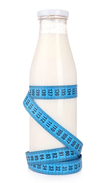 Bottle of milk with measuring tape isolated on white — Stock Photo, Image