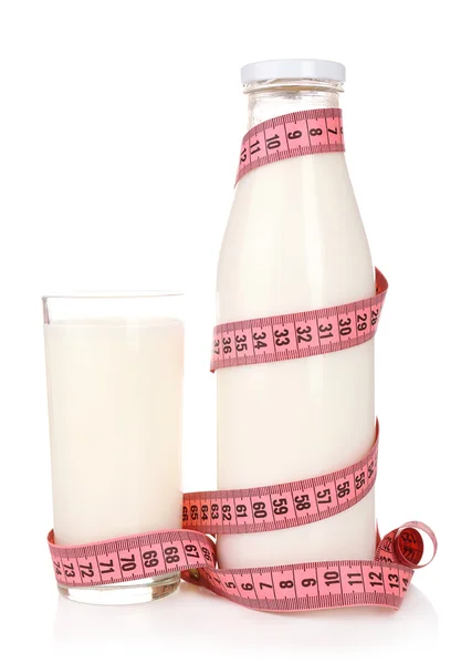 Bottle of milk with measuring tape isolated on white — Stock Photo, Image