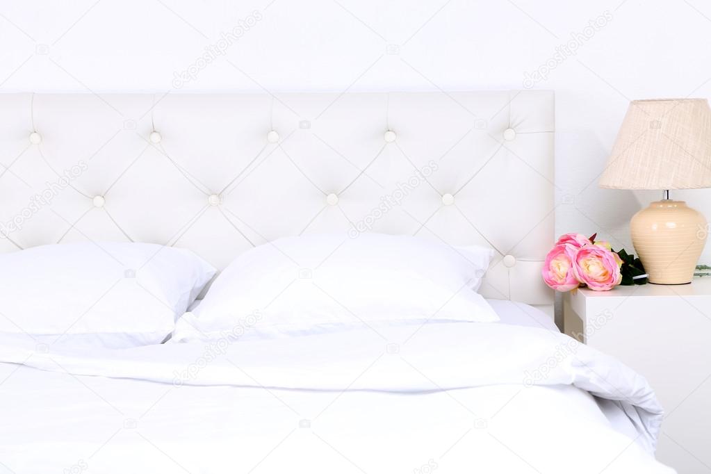 Comfortable soft bed with pillows