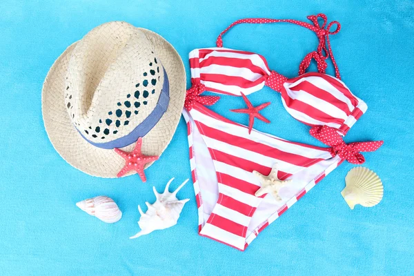 Swimsuit on color background — Stock Photo, Image