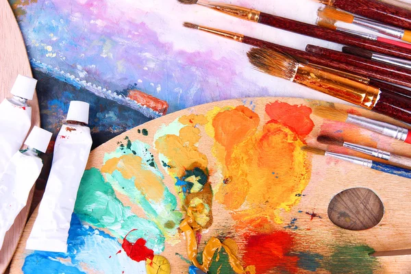 Artistic equipment: paint, brushes and art palette — Stock Photo, Image