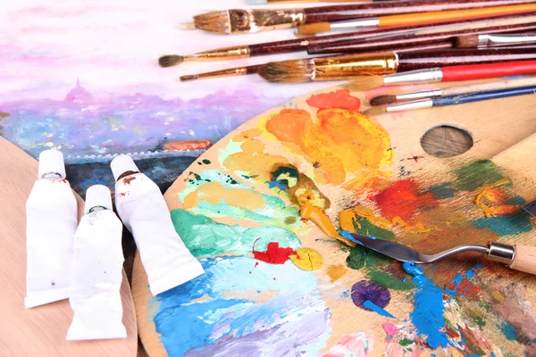 Artistic equipment: paint, brushes and art palette — Stock Photo, Image