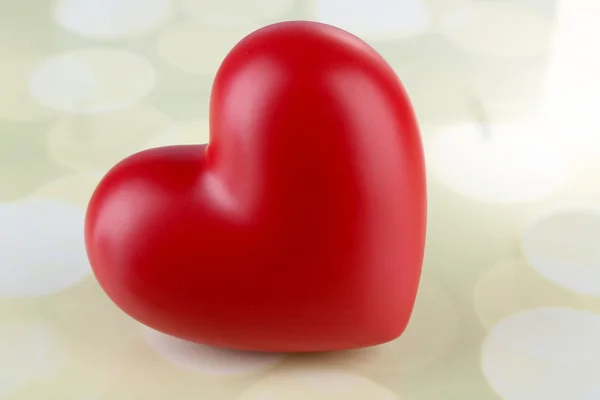 Red heart on light background — Stock Photo, Image