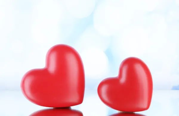 Red hearts on light background — Stock Photo, Image