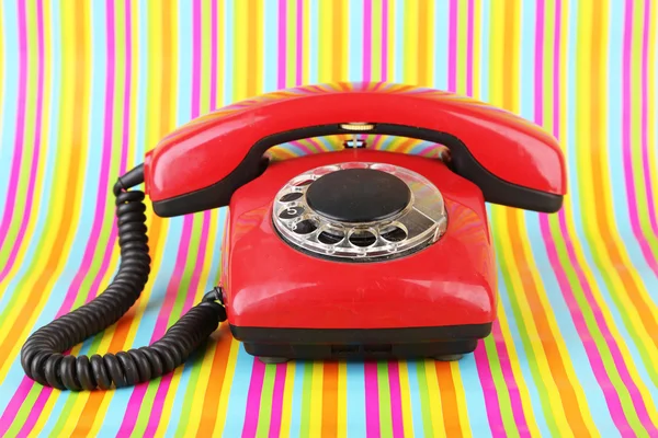 Red retro telephone on bright background — Stock Photo, Image