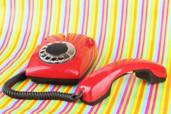 Red retro telephone on bright background — Stock Photo, Image