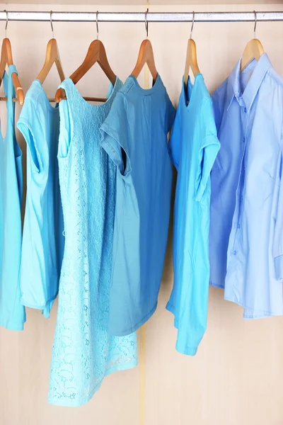 Female clothes on hangers in wardrobe — 스톡 사진