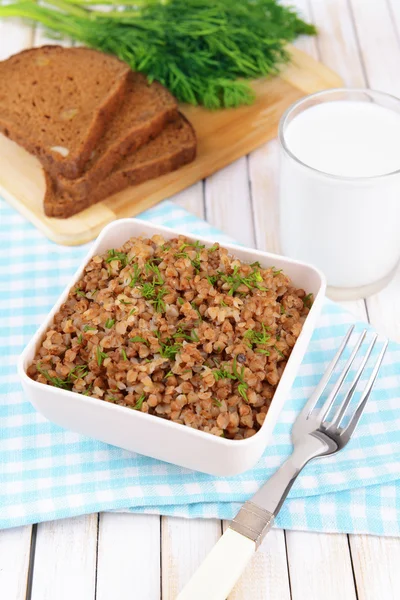 Boiled buckwheat in bowl on table close-up — Stock Photo, Image