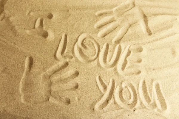 Hand prints in sand as nice summer background — Stock Photo, Image