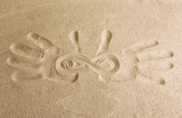 Hand prints in sand as nice summer background — Stock Photo, Image