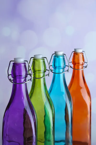 Colorful bottles on light background — Stock Photo, Image