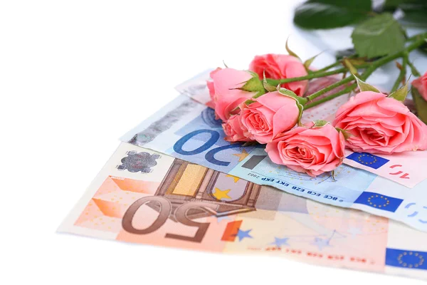 Beautiful roses and money, isolated on white — Stock Photo, Image