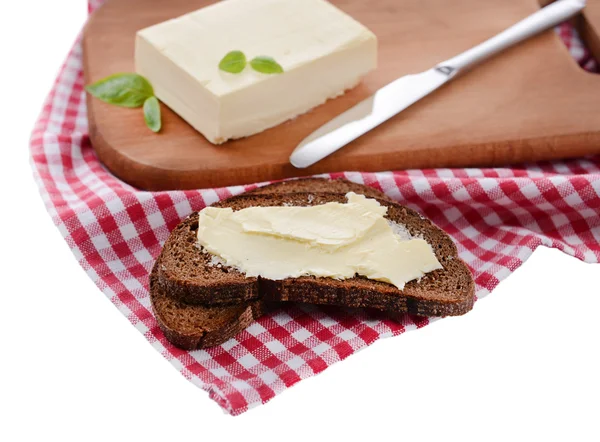 Rebanada de pan de centeno con mantequilla, aislado en blanco —  Fotos de Stock