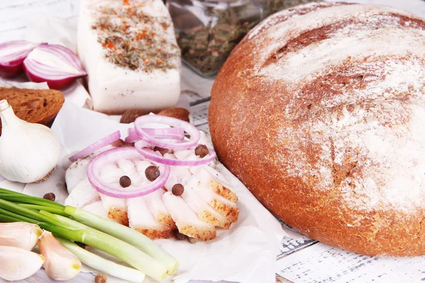 Rye bread with lard and onion on table close up — Stock Photo, Image