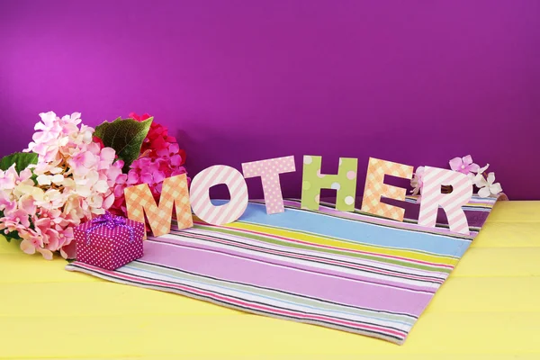 Mother- lettering of handmade paper letters on purple background — Stock Photo, Image