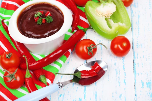 Tomato sauce in bowl on wooden table close-up — Stock Photo, Image