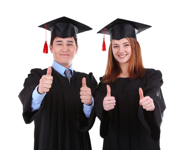 Dois estudantes graduados felizes isolados em branco Imagem De Stock