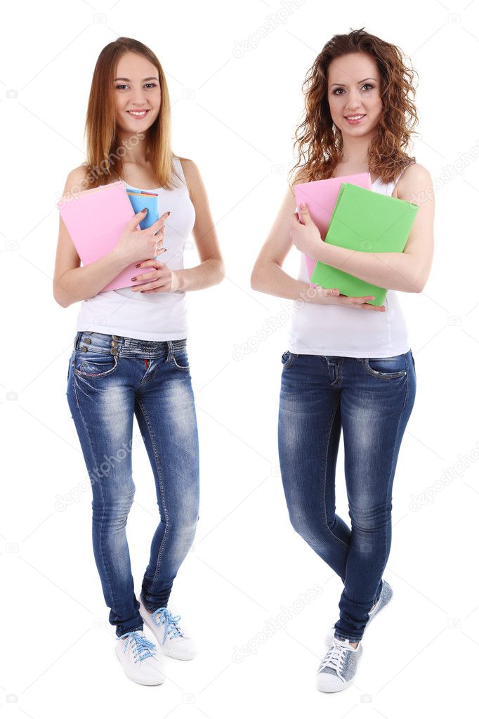 Beautiful young women holding books isolated on white