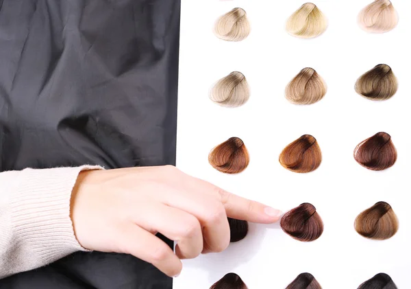 Hair stylist with hair samples of different colors, close-up — Stock Photo, Image