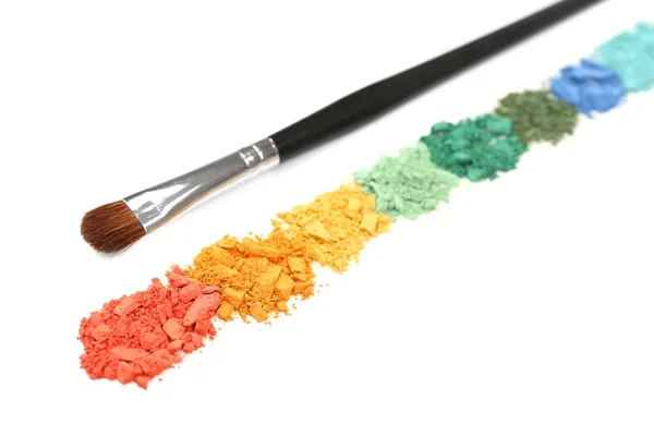 Rainbow crushed eyeshadow and professional make-up brush isolated on white — Stock Photo, Image