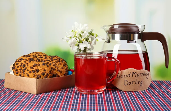 Tasty herbal tea and cookies on table — Stock Photo, Image