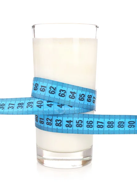 Glass of milk with measuring tape isolated on white — Stock Photo, Image