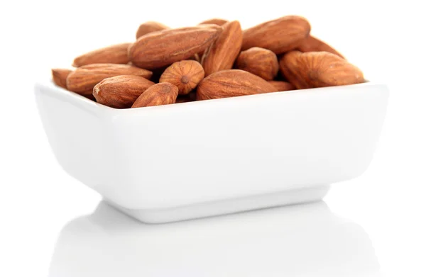 Almond in bowl, isolated on white — Stock Photo, Image