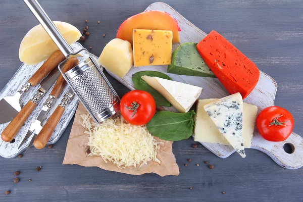 Different Italian cheese on wooden background — Stock Photo, Image