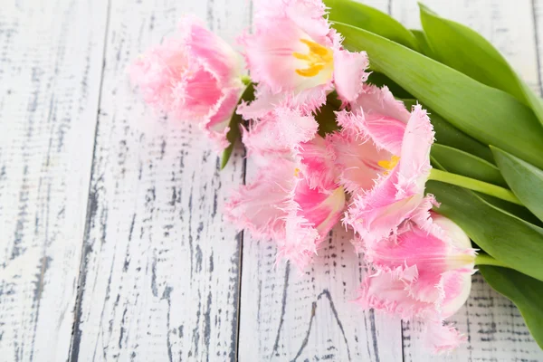 Beautiful tulips on wooden background — Stock Photo, Image