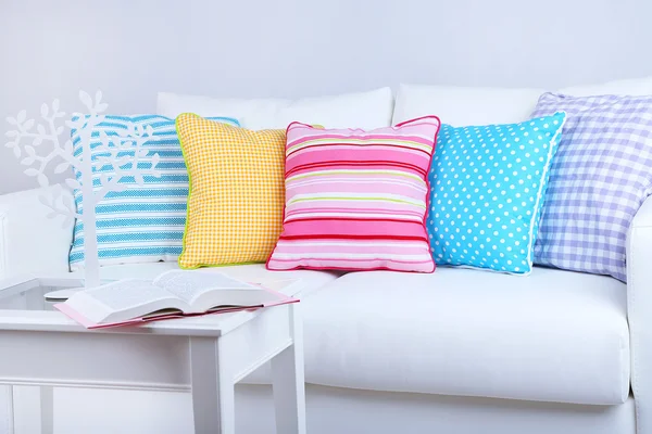 White sofa with colorful pillows in room — Stock Photo, Image