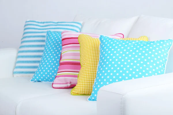 White sofa with colorful pillows in room — Stock Photo, Image