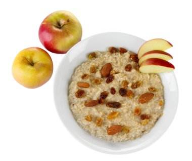 lezzetli yulaf ezmesi kuru üzüm ve elma üzerine beyaz izole