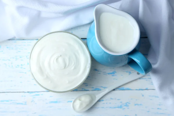 Dairy products on wooden table background — Stock Photo, Image