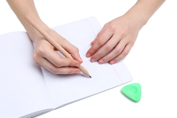 Mãos humanas com lápis e borracha de apagar e notebook, isolado em branco — Fotografia de Stock