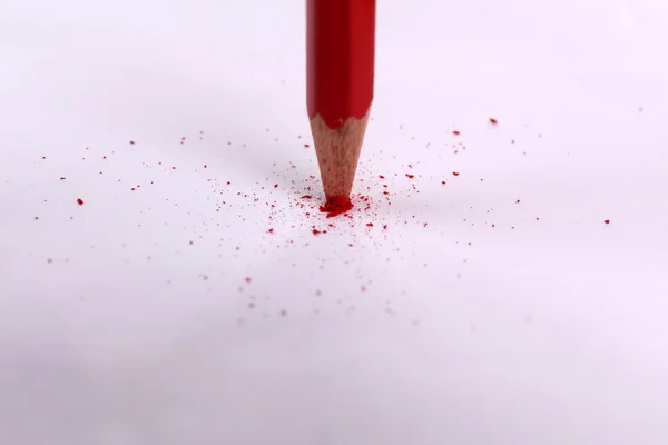 Breaking pencil on paper, close up — Stock Photo, Image