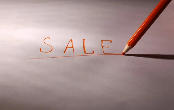 Word Sale and pencil on paper, close up — Stock Photo, Image