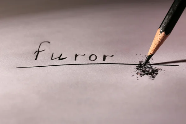 Word Furor and breaking pencil on paper, close up — Stock Photo, Image